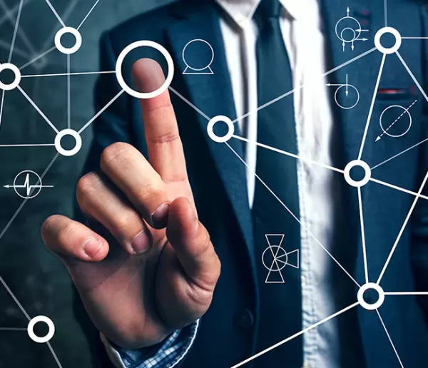 man in background with hand pointing at interconnecting circles