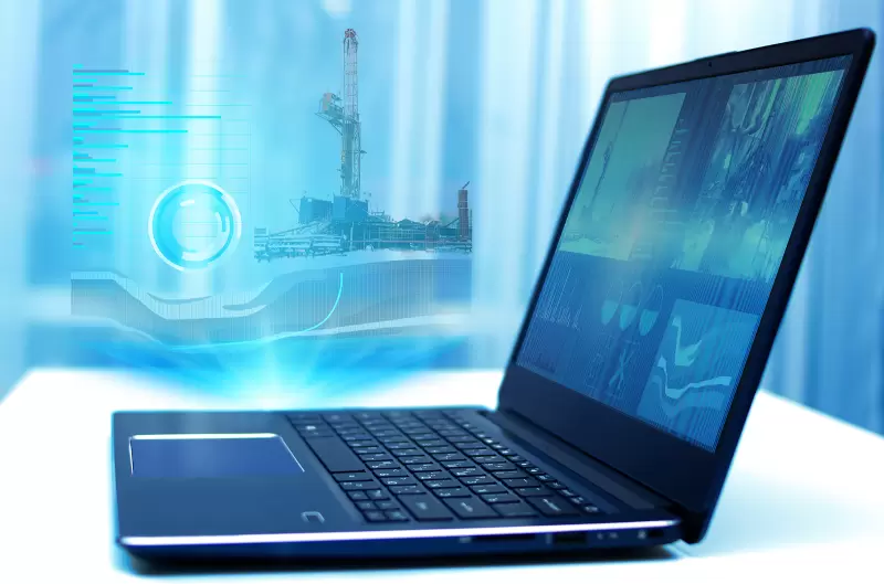 A hologram on a laptop drilling a well