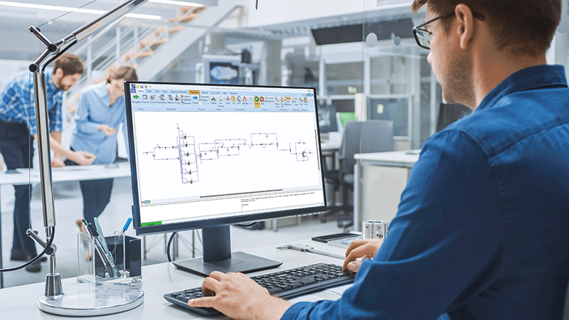 Engineer working at monitor in office