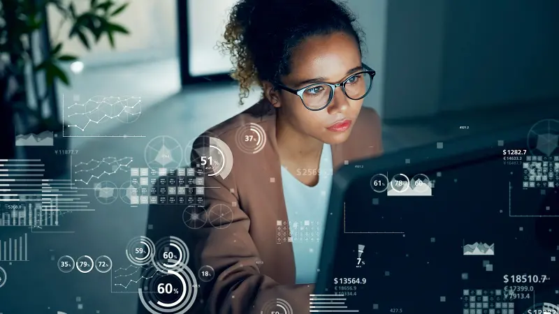 Visual of data analysis with woman working in the office