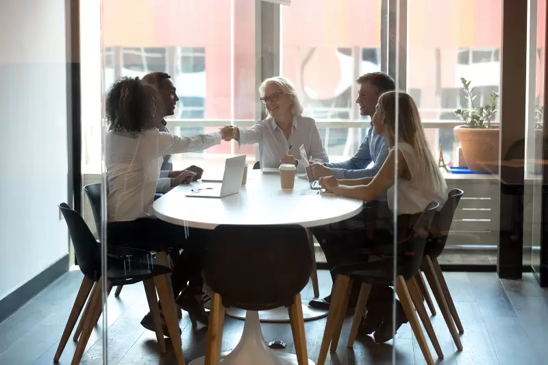 group of business people meeting round a table