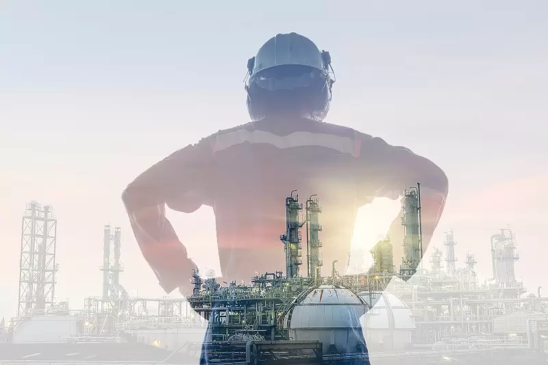 petrochemical industry plant with engineer standing in front